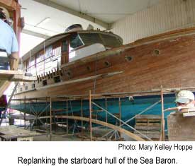 Replanking the starboard hull of the Sea Baron