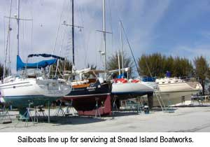 Sailboats line up for servicing at Snead Island Boatworks