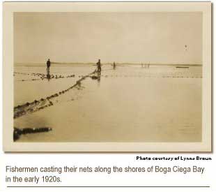 Fishermen casting their nets along the shores of Boga Ciega Bay in the early 1920s.