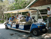 Golf cart takes kids along Camp Bayou attractions