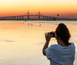 Kathleen Finnerty is photographed while shooting the Sunshine Skyway Bridge. Photo by Judy Rogero
