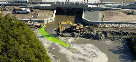 Green dye flows through the newly breached causeway at Fort DeSoto in 2014. Photo courtesy National Oceanic and Atmospheric Administration