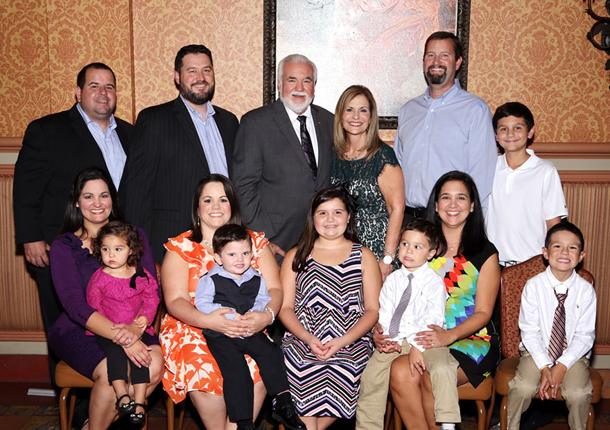 Pumariega’s close-knit family joined his retirement celebration at the Columbia Restaurant. Top row, from left to right are son-in-laws Luis Suarez and Troy Howell, Manny and Doreen Pumariega, son-in-law Trey Dean and grandson Charlie Dean. Front row, Dina Pumariega Howell and Grace Howell; Lisa Pumariega Suarez and Lucas Suarez; granddaughter Julia Dean, Natalie Pumariega Dean with Bradley Howell and Justin Howell.